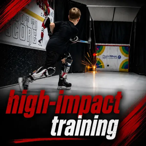 Young hockey player in black gear blasts a shot in an indoor training area; sparks fly near the target as bold red 'high-impact' and white 'training' text overlays the scene.